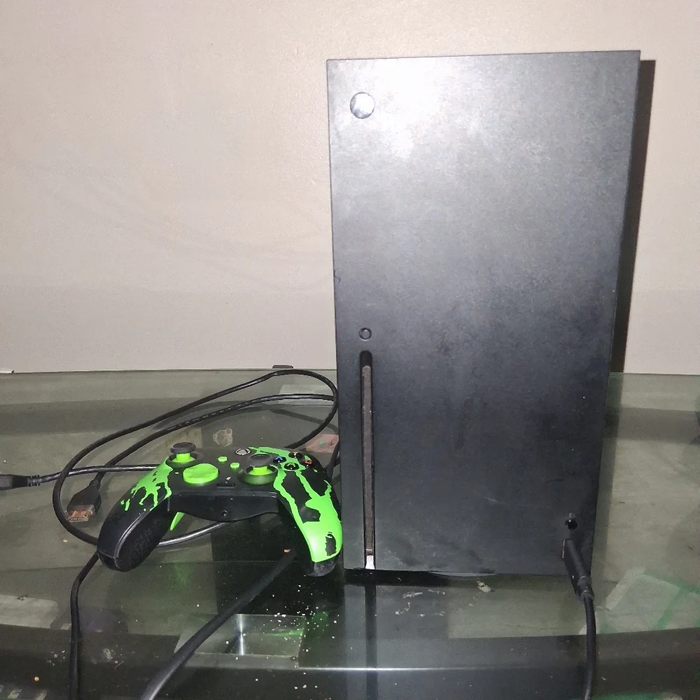Black Gaming Console with Green Controller